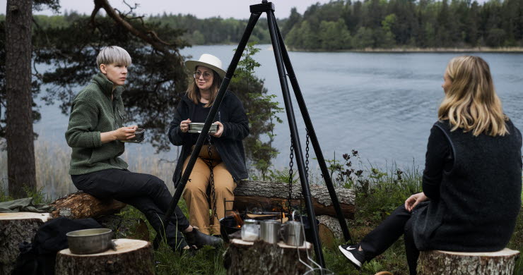 Friends enjoying outdoor cooking in Dalsland