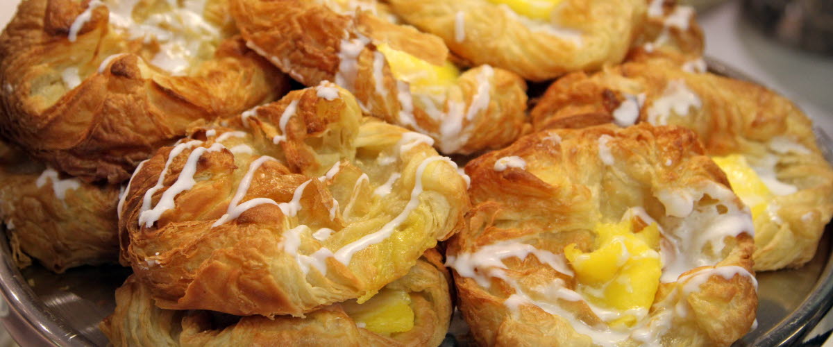 Several pastries on a barrel.