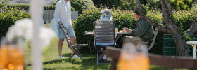 Guests enjoy good food in the garden at Kosterhavets Ekobod.