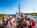 People sit on the upper deck on their way out to Koster Islands with the Koster boat.